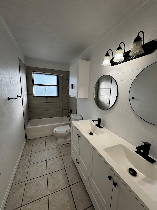 full bathroom with toilet, tile patterned floors, tiled shower / bath combo, ornamental molding, and vanity