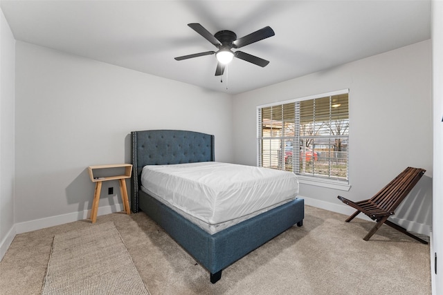 bedroom with ceiling fan and carpet floors