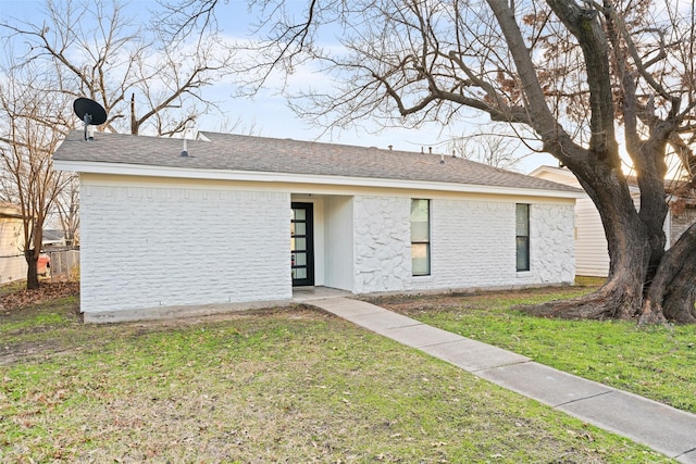 ranch-style home with a front yard