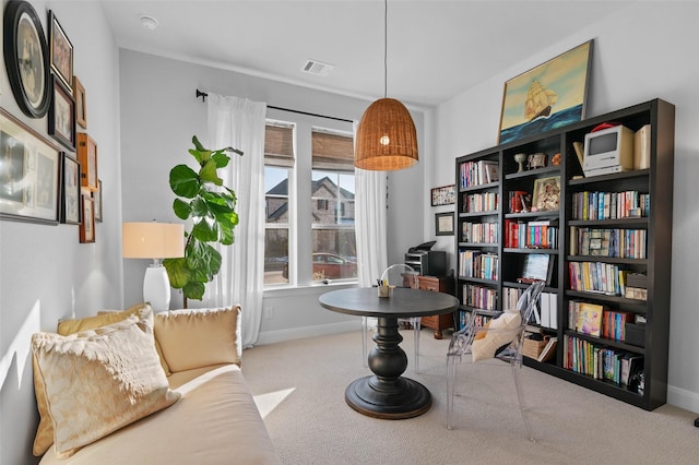 living area with light carpet