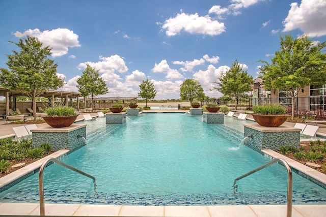 view of pool featuring pool water feature