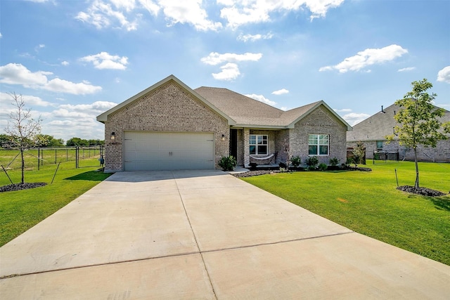 view of front of home featuring a garage and a front lawn