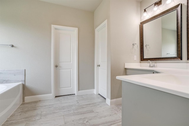 bathroom with vanity and a bathing tub