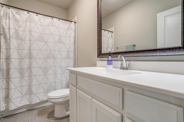 bathroom with curtained shower, tile patterned floors, vanity, and toilet