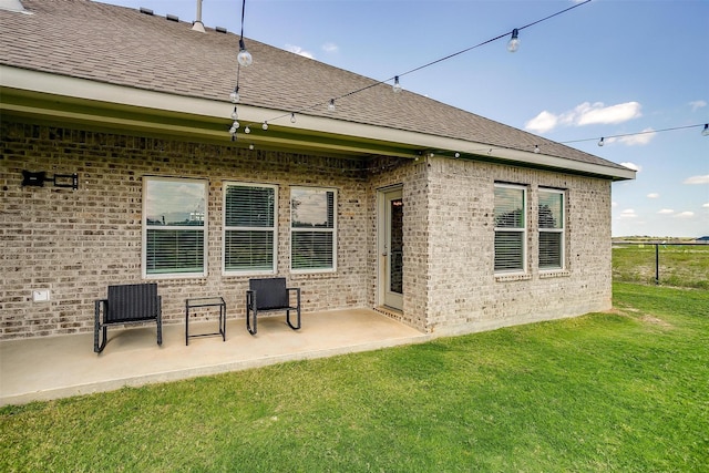 back of house featuring a yard and a patio