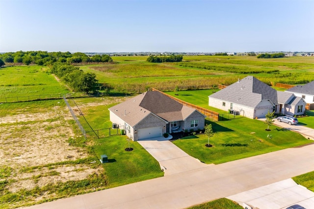 birds eye view of property with a rural view