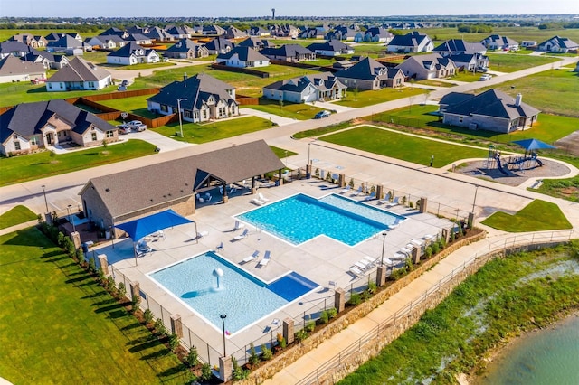 view of swimming pool featuring a water view