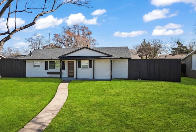 single story home featuring a front yard