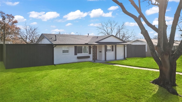 back of house featuring a yard