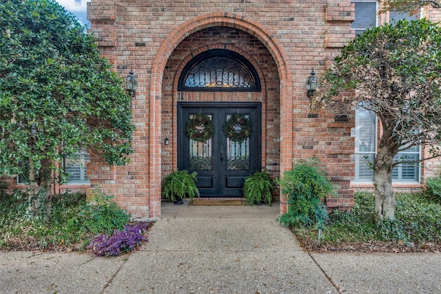 view of exterior entry featuring french doors