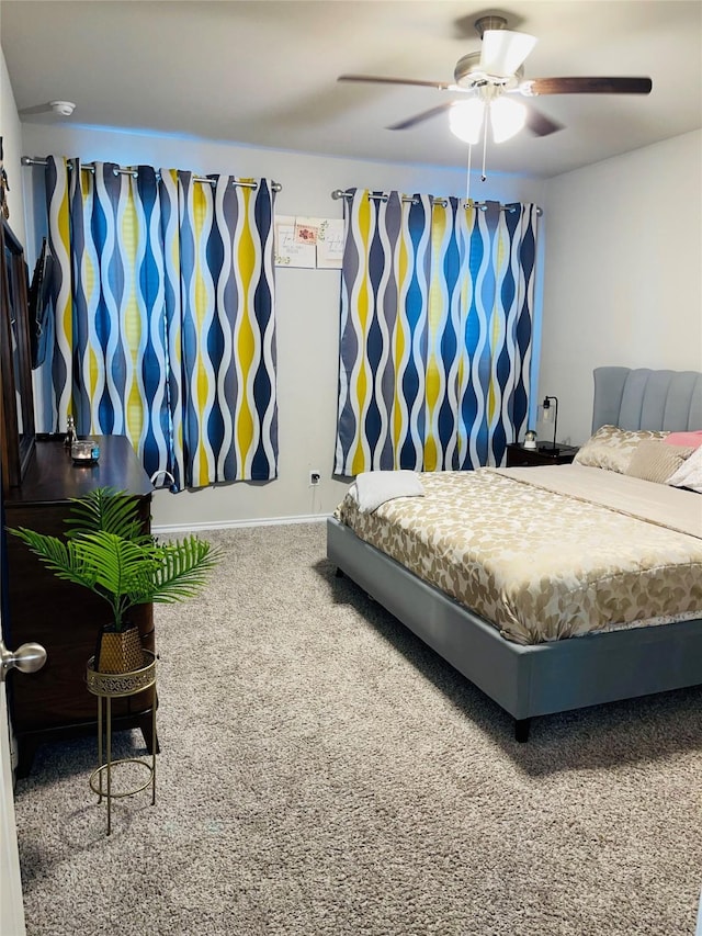 bedroom with ceiling fan and carpet floors