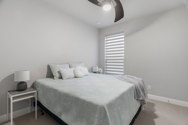 bedroom featuring light carpet and ceiling fan