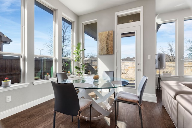 dining area featuring dark wood-type flooring