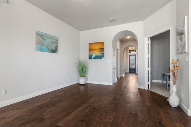 spare room featuring dark hardwood / wood-style floors