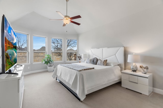 carpeted bedroom with lofted ceiling and ceiling fan