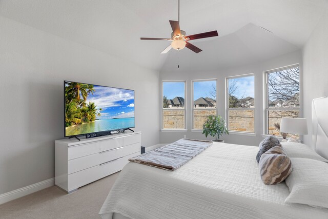 carpeted bedroom featuring vaulted ceiling and ceiling fan