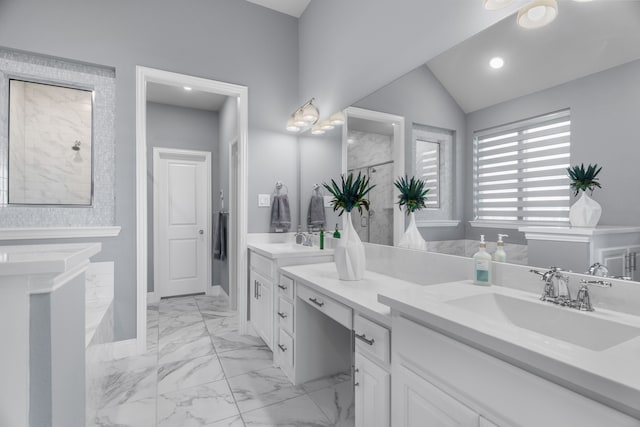 bathroom with lofted ceiling and vanity