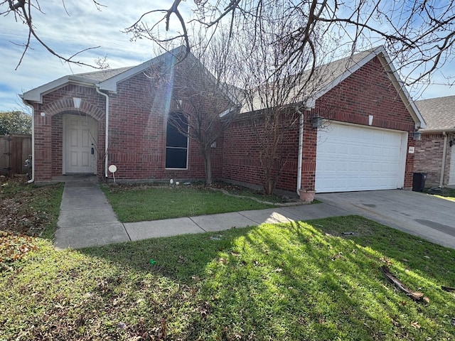 view of front of property with a front lawn and a garage