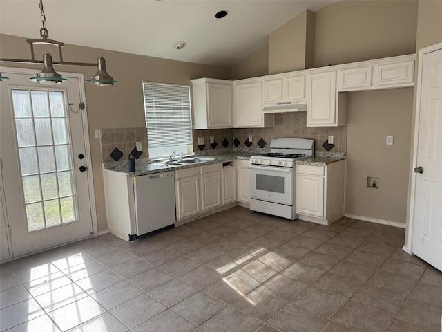 kitchen featuring dishwasher, vaulted ceiling, gas range gas stove, backsplash, and white cabinets