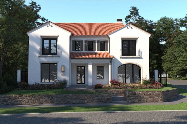 mediterranean / spanish house with a balcony