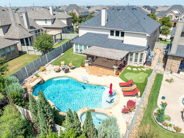 view of pool featuring a patio area and an in ground hot tub