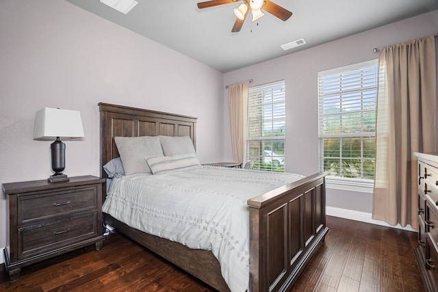 bedroom with lofted ceiling, dark hardwood / wood-style flooring, and ceiling fan