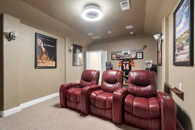 carpeted cinema featuring vaulted ceiling