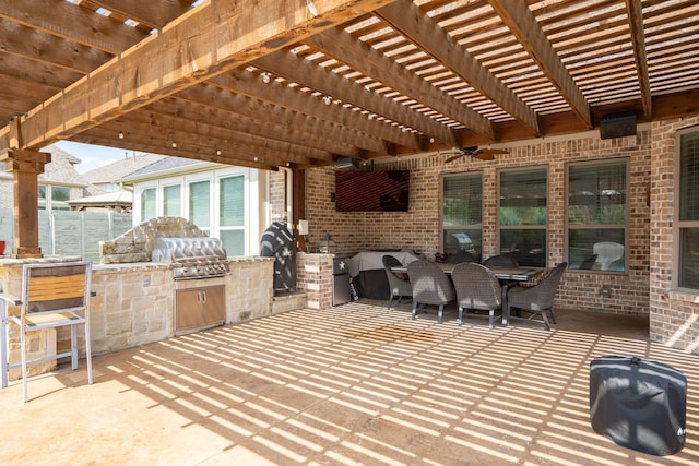 view of patio with an outdoor kitchen, a grill, and a pergola