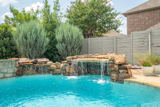 view of swimming pool featuring pool water feature