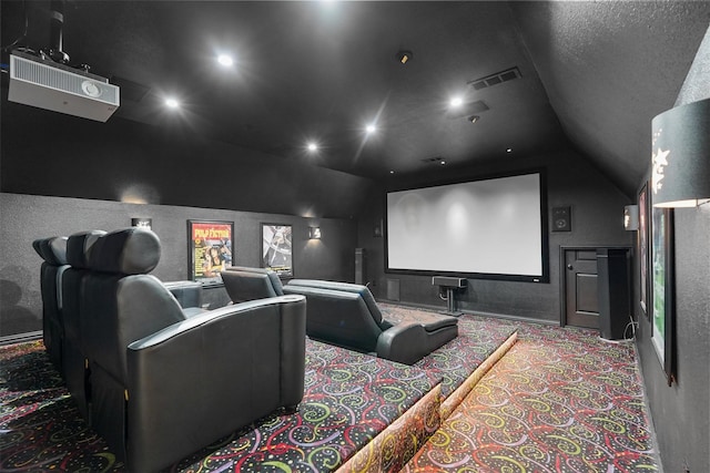 home theater with light carpet and vaulted ceiling