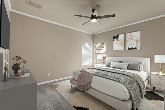 bedroom with ceiling fan, carpet flooring, and crown molding