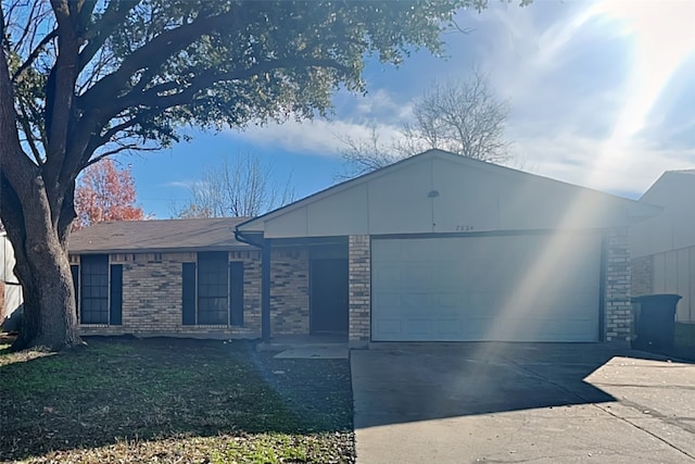 ranch-style home with a garage