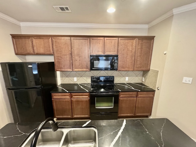 kitchen featuring tasteful backsplash, black appliances, and ornamental molding