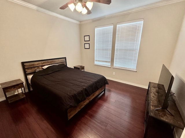 bedroom with ceiling fan, dark wood-type flooring, and ornamental molding