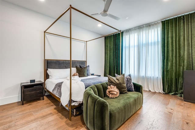 bedroom featuring ceiling fan and light hardwood / wood-style flooring