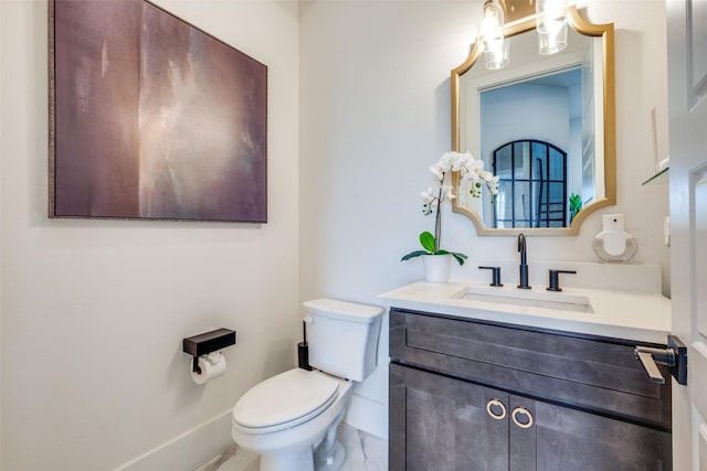 bathroom with toilet and vanity