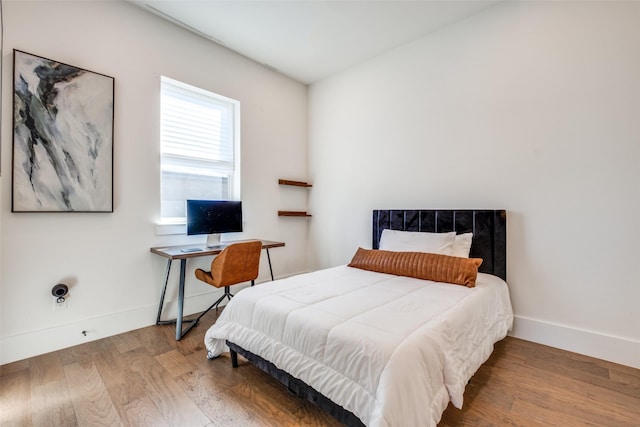 bedroom featuring hardwood / wood-style floors