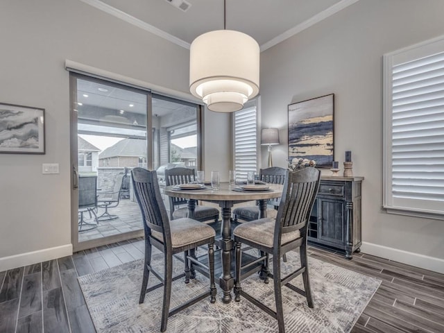 dining area with crown molding