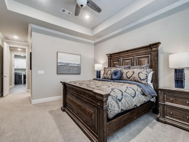 carpeted bedroom featuring ornamental molding, a raised ceiling, and ceiling fan