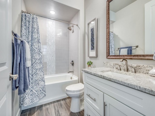 full bathroom with toilet, shower / tub combo, and vanity