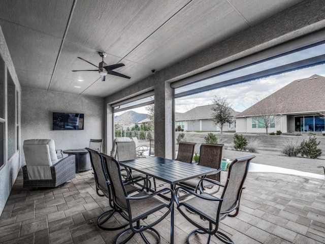 view of patio / terrace featuring ceiling fan