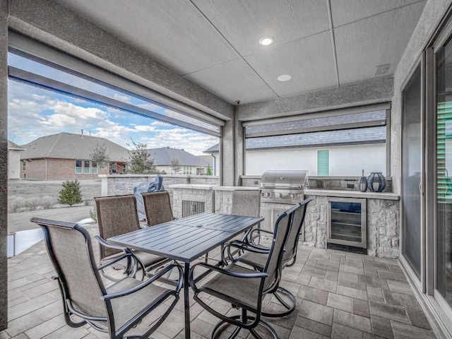 view of patio / terrace with a grill, area for grilling, and wine cooler