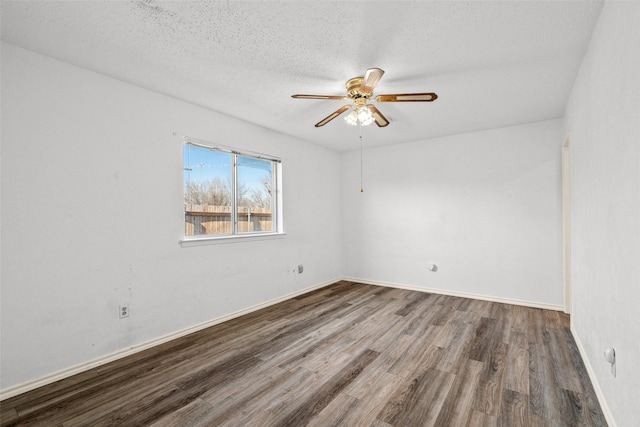 unfurnished room with ceiling fan, a textured ceiling, and wood-type flooring