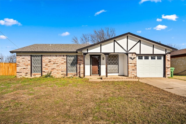 view of front of house with a front yard and a garage