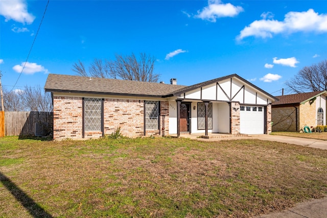 view of front facade with central AC unit, a garage, and a front lawn