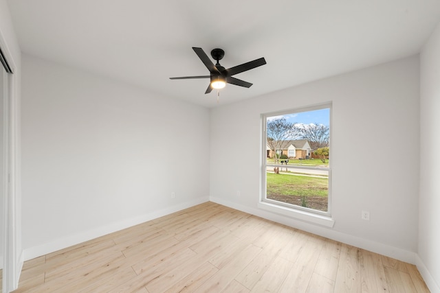 unfurnished room with ceiling fan and light hardwood / wood-style flooring