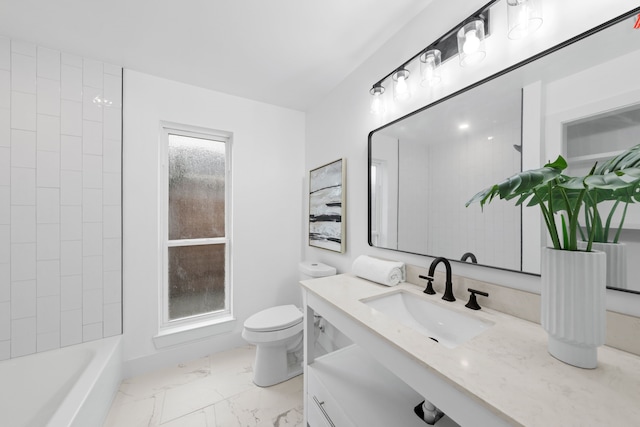 full bathroom with tiled shower / bath combo, vanity, and toilet