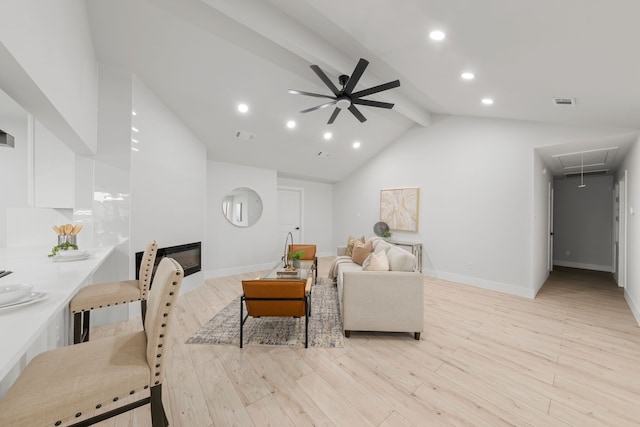 living room featuring high vaulted ceiling, ceiling fan, light wood-type flooring, and beamed ceiling