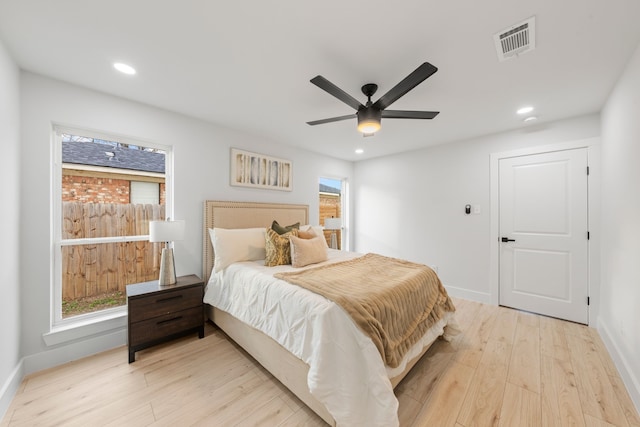 bedroom featuring ceiling fan and light hardwood / wood-style flooring