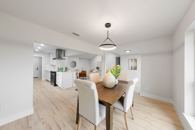 dining room with light hardwood / wood-style floors